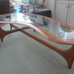 Adding Style And Comfort With A Glass Kidney Shaped Coffee Table